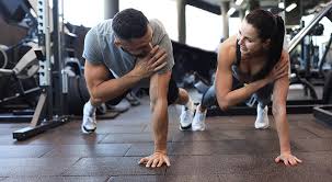 Toning Bingo Wings: Your Ultimate Guide to Sculpting Sleek Arms at the Gym 3 Fitness trainer demonstrating arm toning exercises Cambridge